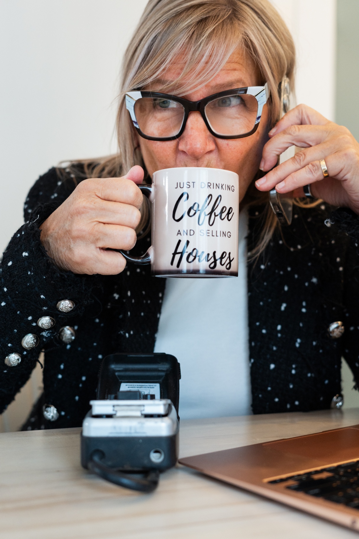 Karen Roy with coffee in her office